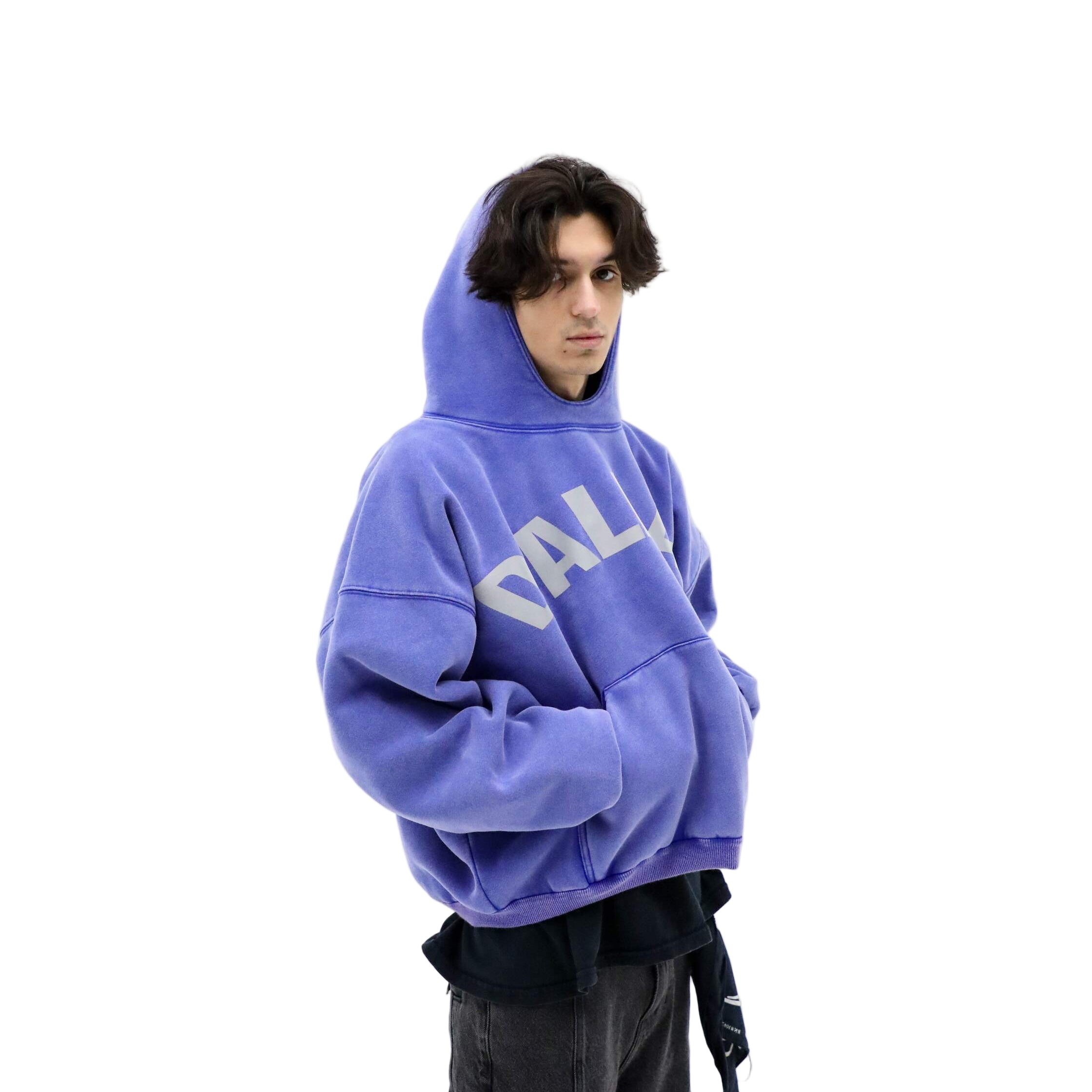 Person wearing a blue hoodie with 'DALLAS' text on a white background